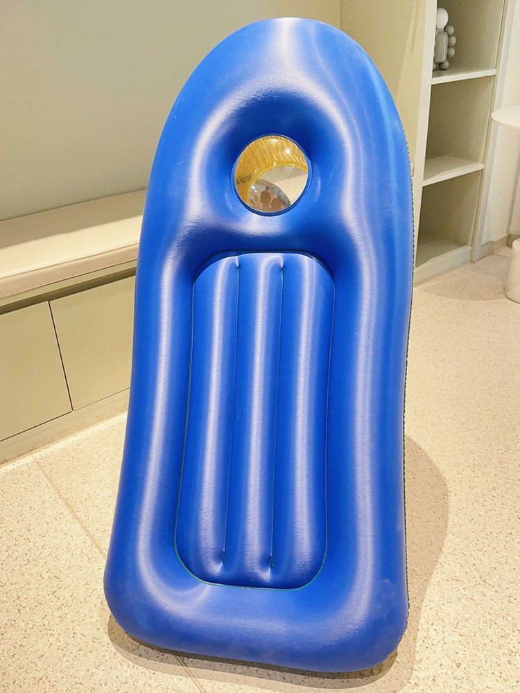 The pool floats toy children surfing the pool waterboards on the waterboards of the plumbeds