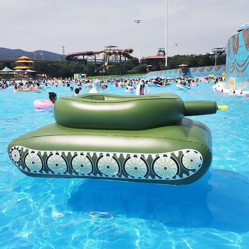 Children's inflating toy tank swimming pool surfing on a sit-in-a-seating boy with a floating water gun