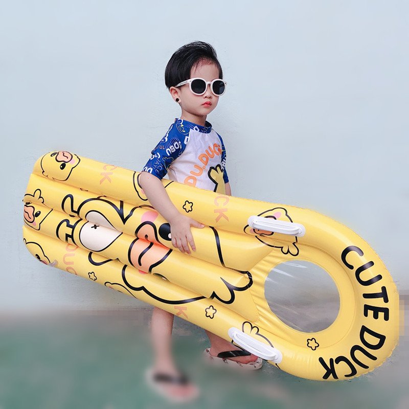 The pontoon inflating surfboard children floating on the water and playing with the floating ducks riding on the flopbed to learn how to swim the waterboard