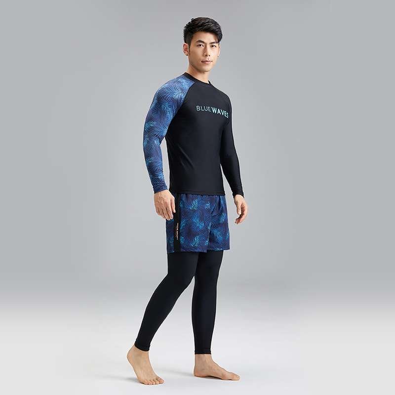 Outside. New part bathing suit for a man with a black dry-dry surfing suit