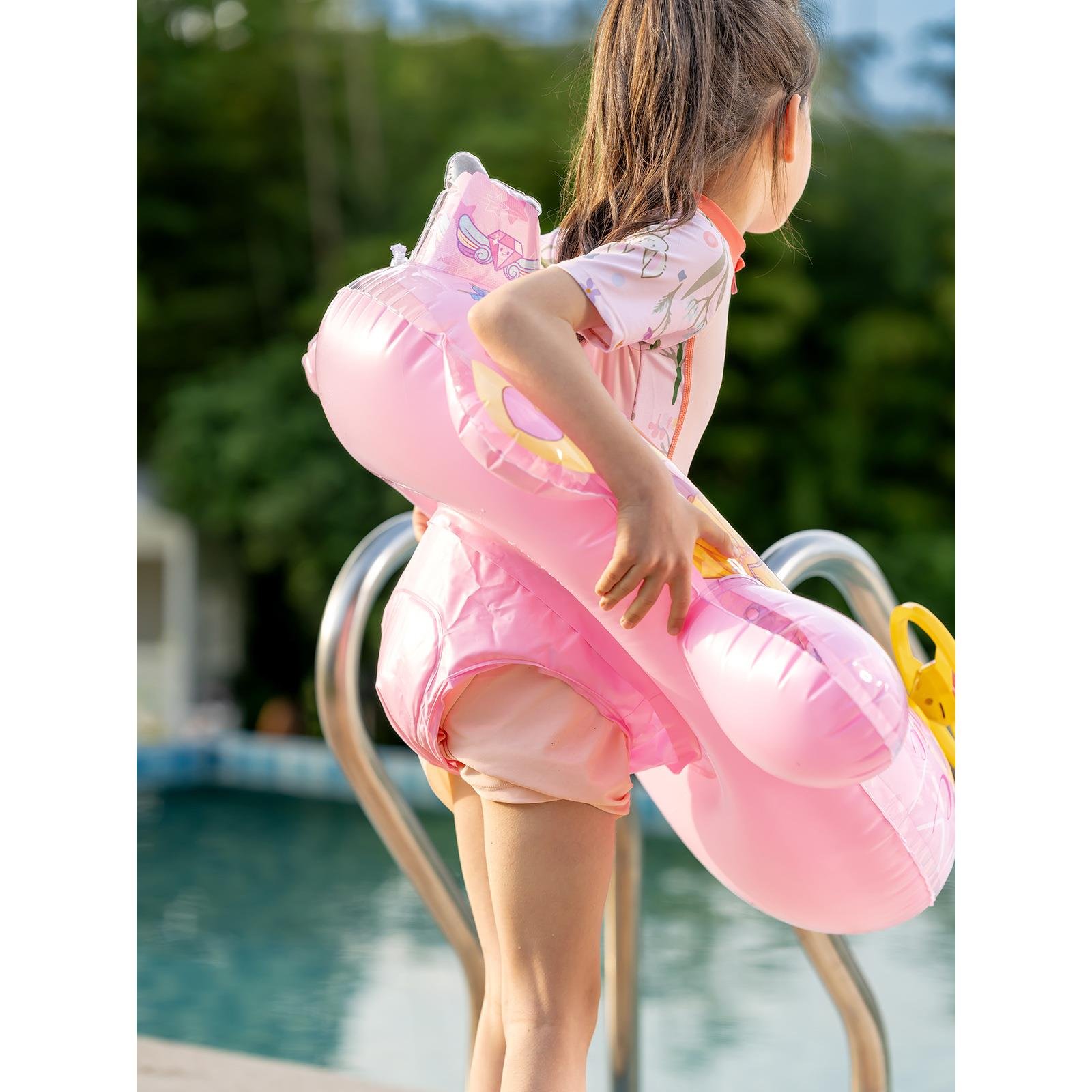 Swimming waterboarding adults from the swimming ring floats, children from the water-powered floats, adults from the sea