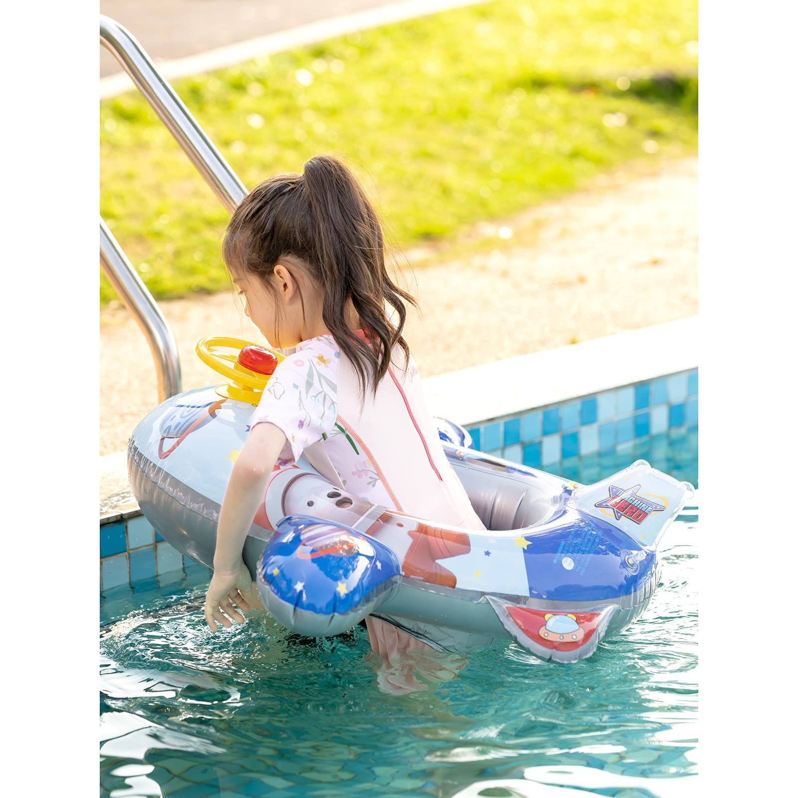 Swimming waterboarding adults from the swimming ring floats, children from the water-powered floats, adults from the sea