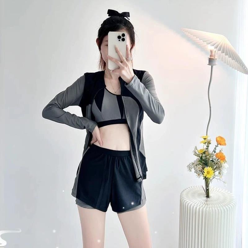 Long-sleeved long-sleeved bathing suit-- a woman in a big bathing suit