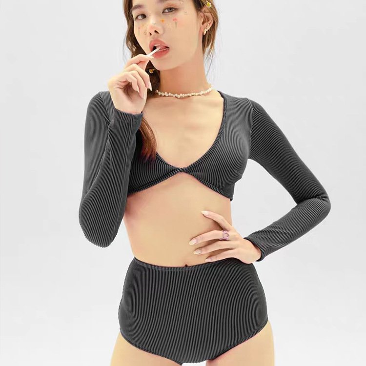 Berry-coloured long-sleeve, hot-swipe surfer, bikini high waist liner, white sea sunscreen