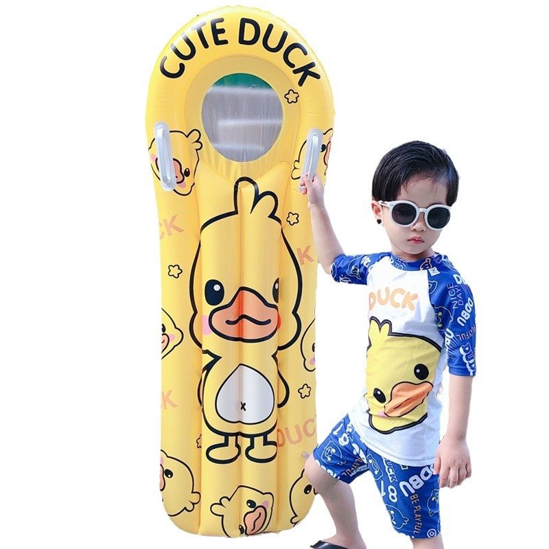 The pontoon inflating surfboard children floating on the water and playing with the floating ducks riding on the flopbed to learn how to swim the waterboard