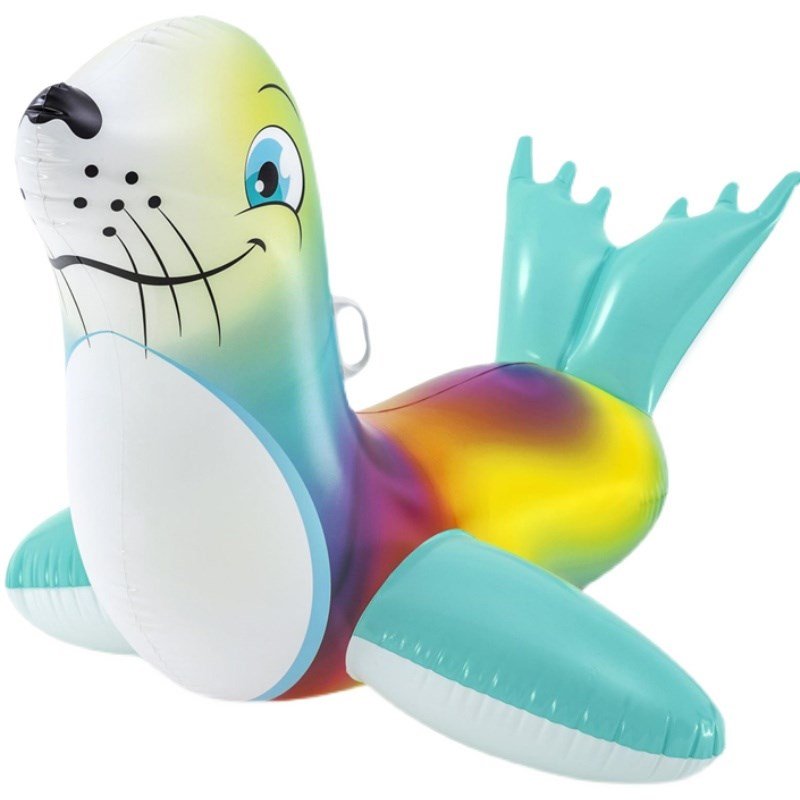 A LITTLE INFLATABLE SWIMMING RING FLUORESCENT SEALS RIDING A BABY BOY A TO PLAY WITH A CHILD SURFER