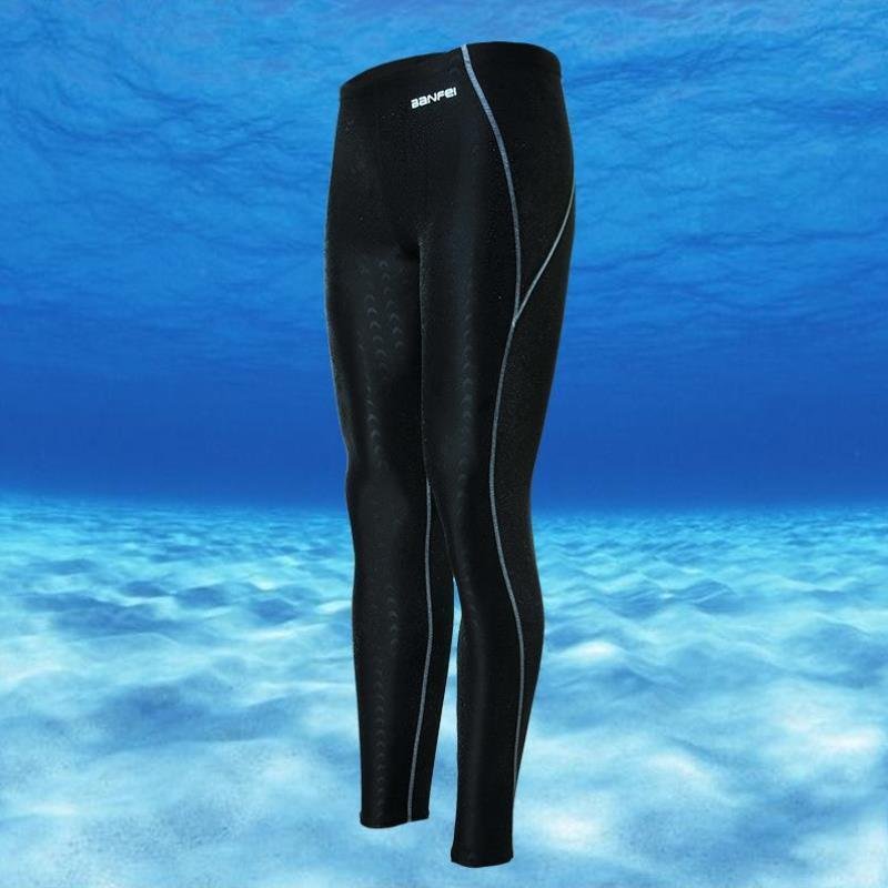Shark-skin dry-skinned, waterproof-pants-skinned man surfing like a nine-minute long shorts-spaned jellyfish