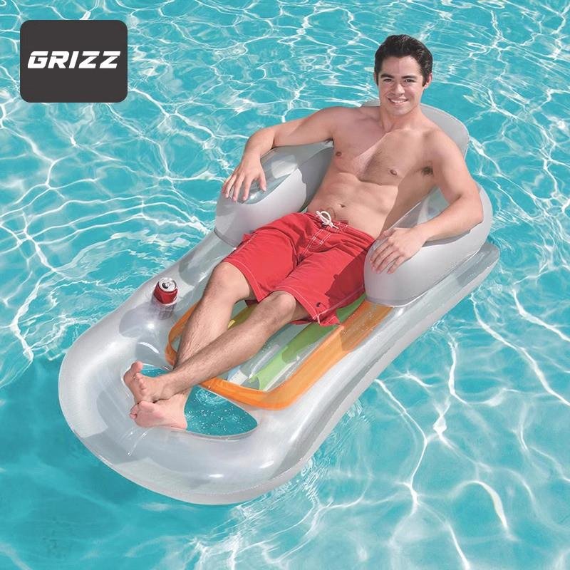 Inflated floating mattresses in the water of the seaboard beach of the German adult floundering swimming ring