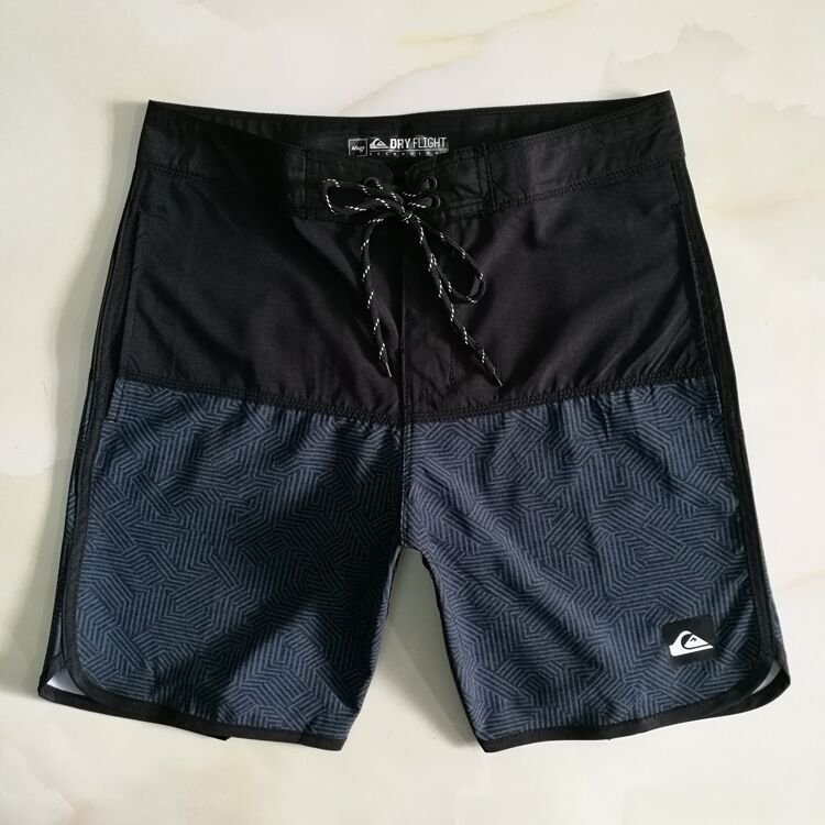 A man in a beach pants can go down to dry surf shorts at speed