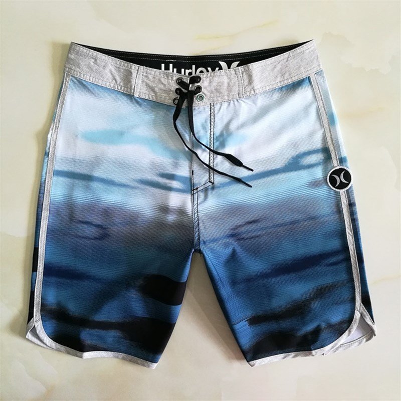 A man in a beach pants can go down to dry surf shorts at speed