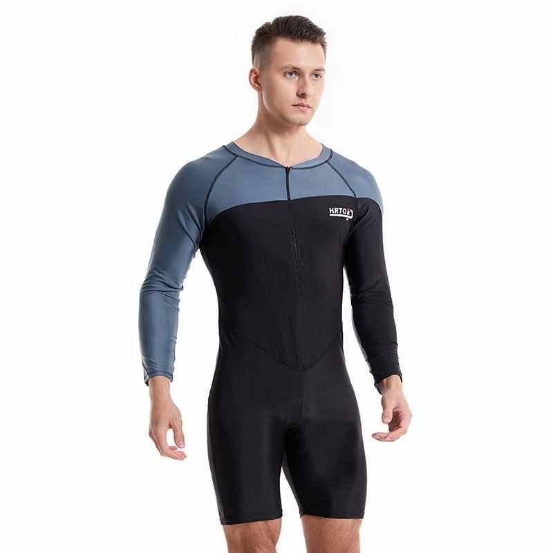 A man with a long-sleeved bathing suit, and a young man with a wet surf suit