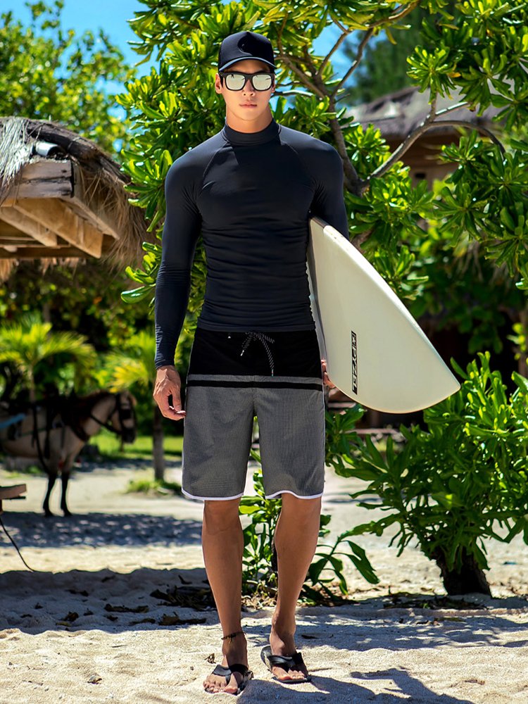Swimming suit for a man with a bathing suit full of sands and surfing suits