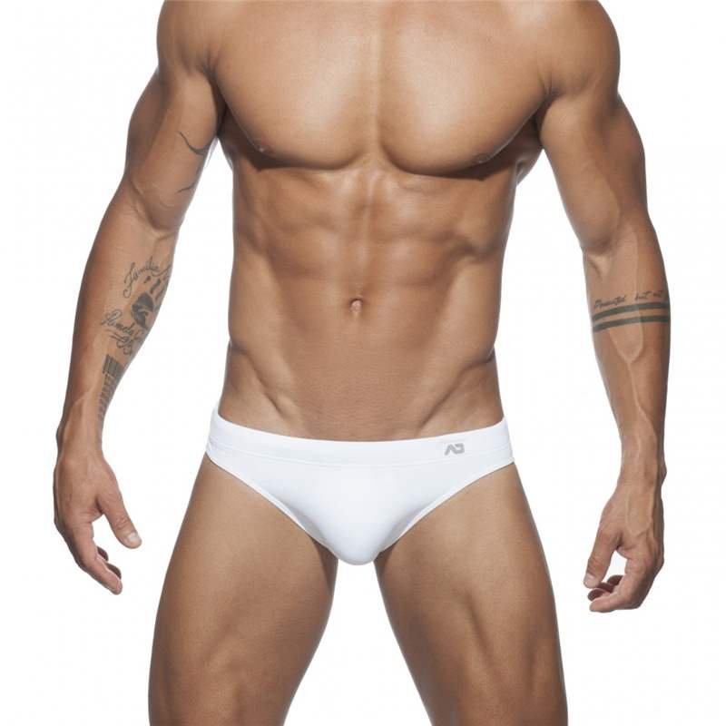 The guy with the swimsuits down his waist with the bikini triangles in a tan, and a sand-basket chute