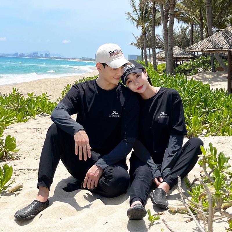 A new couple with a scuba suit, a loose, thin, long-sleeved, long-sleeveed, man-swam suit, a protected hot spring