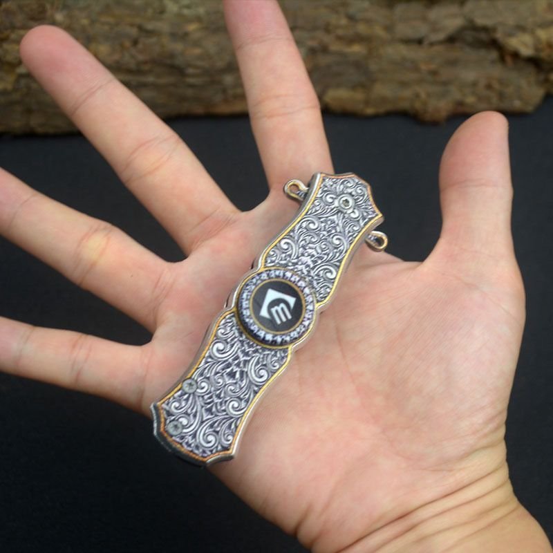 An outdoor folding knife pointed to a multi-purpose mini-cleaver camper with a high-heavy fruit knife