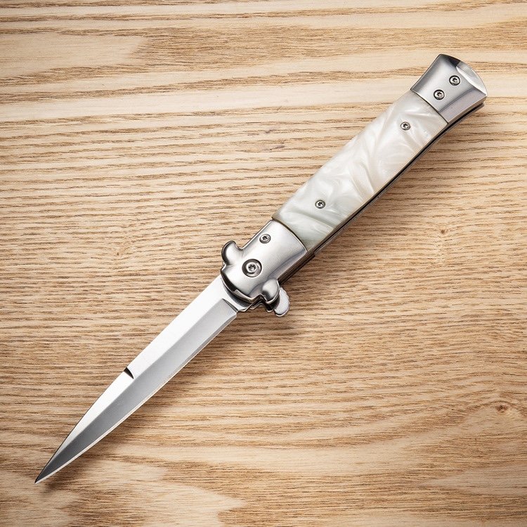 An outdoor steel-colored wood handle with a very hard folding of a fruit knife camping with a pedestal knife