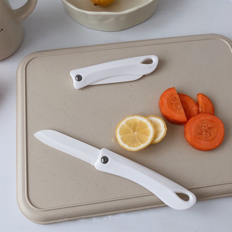 "slice the fruit no more taste" japanese pottery knife folds the fruitins outside, camping with white sidekicks