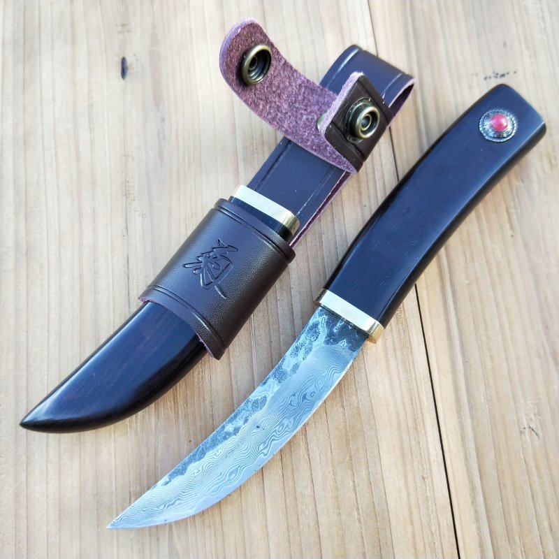 A hand-made Damascus knife with a sling and a straight knife to the camp with a sharp blade