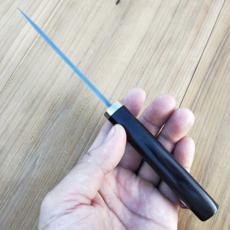 A hand-made Damascus knife with a sling and a straight knife to the camp with a sharp blade