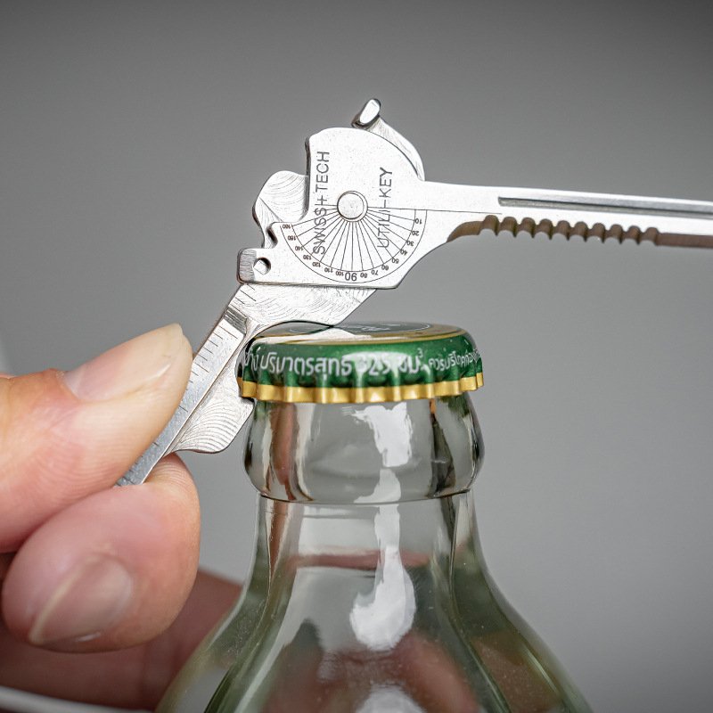 An outdoor multi-purpose tool combination with a key-slice opener with a mini-slice opener