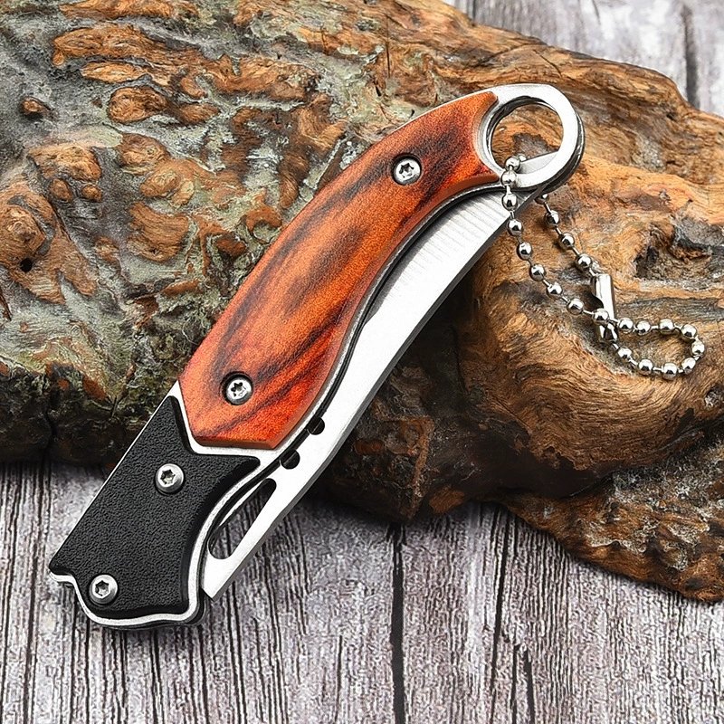 The outside knife folds the knife, and the mini-cruises the key to the knife, and then the knife goes up with it