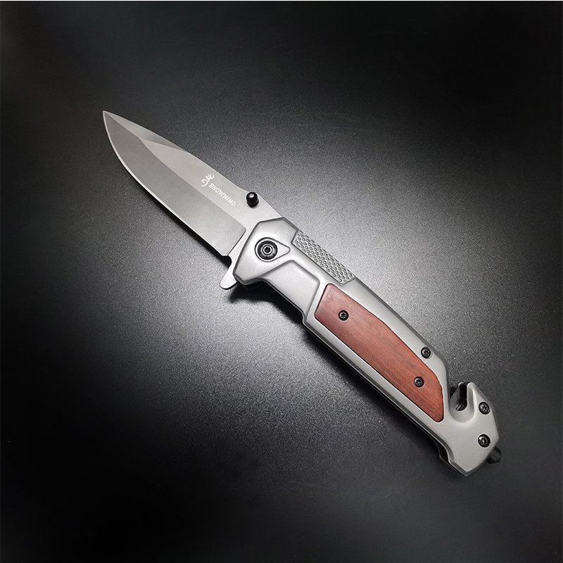 The field camp for a defensive survival knife folds a stainless steel knife to cut a window and cut a rope to survive