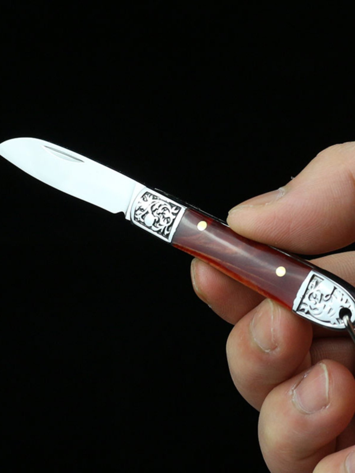 A little knife-mini-cracker with a sharp stainless steel portable outdoor camping fruit knife
