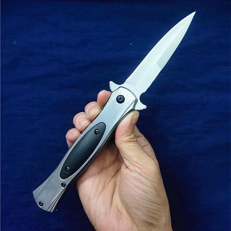 An open-air protection field camping knife folded with a fruit and stainless steel
