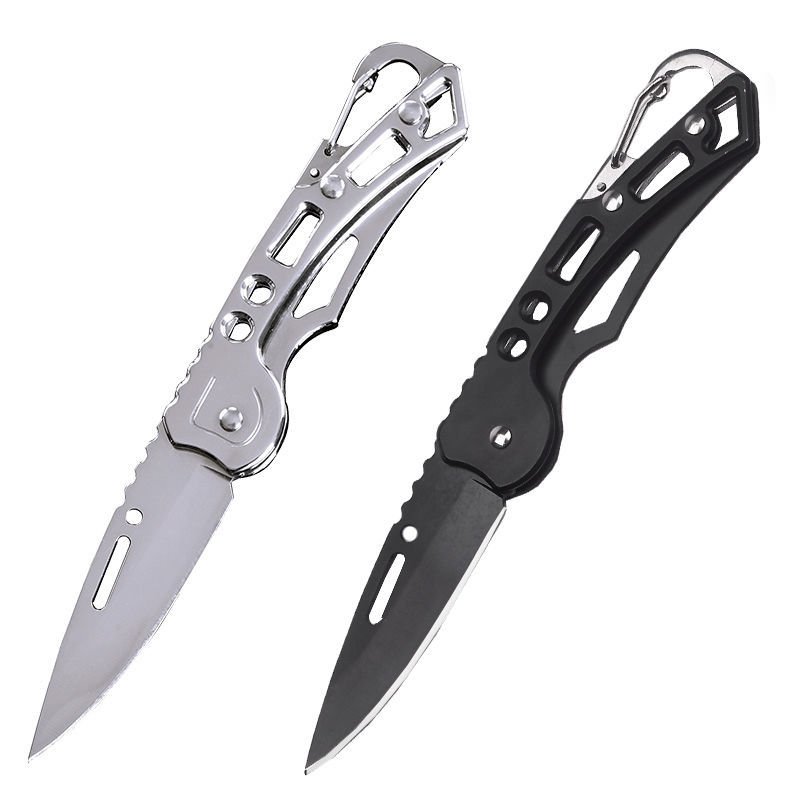 Portable fruit knife folding key buttons, handing over a box of small tungsten and steel knives outside the house