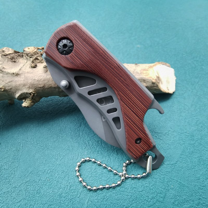 A multi-purpose folder with a high-level mini-fruit knife and a field cutter