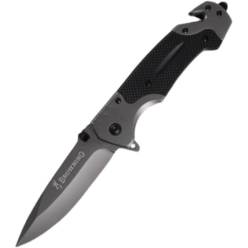 A high hard-on Yang outside the town folding of a small knife in a field camp with a sharp and cold weapon