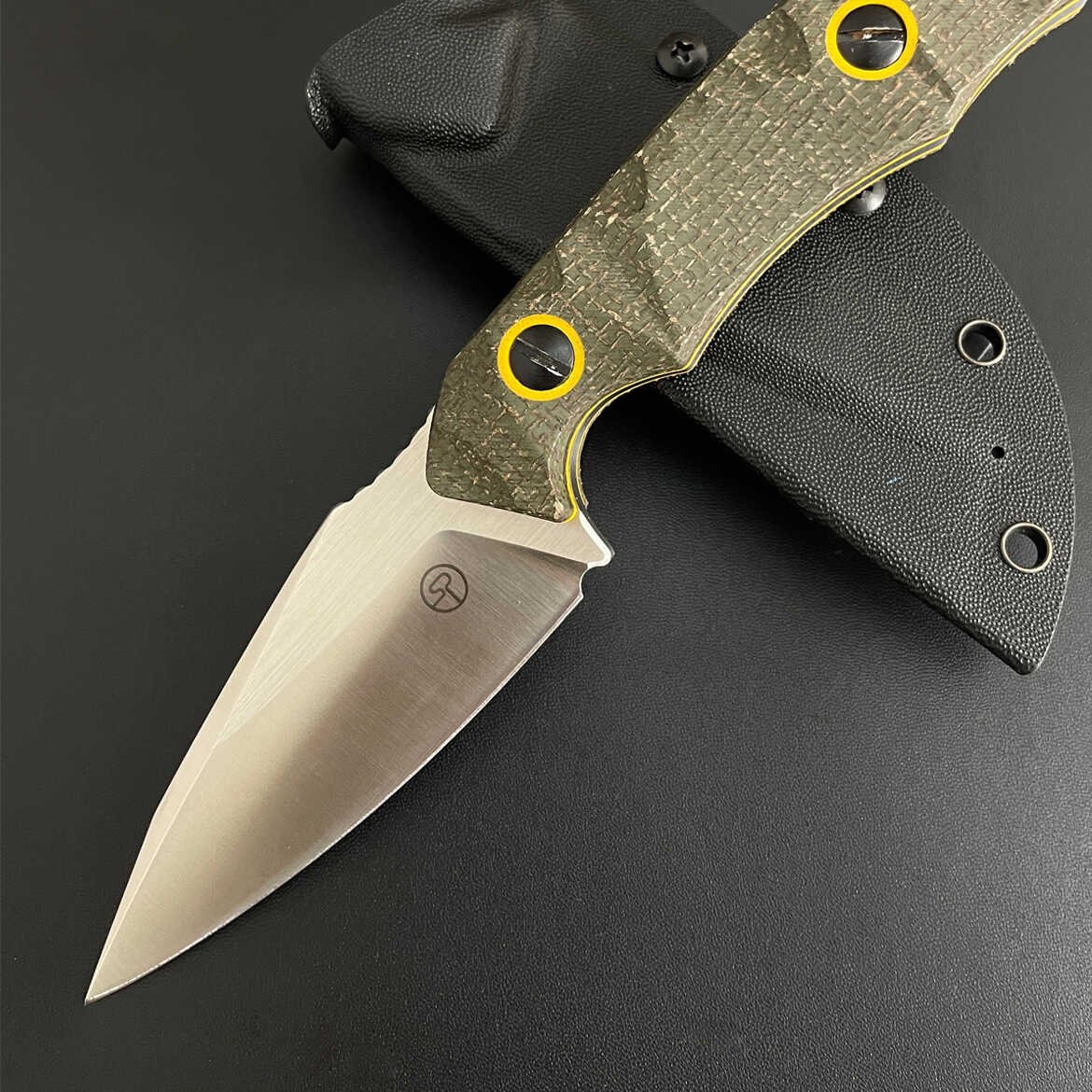 An outdoor knife and a field excursor with a sharp knife to survive outside the house