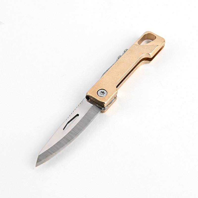 A pocket knife, a brass little knife, a walled-up piece of knife, with a handy delivery key button, a tiny folding knife
