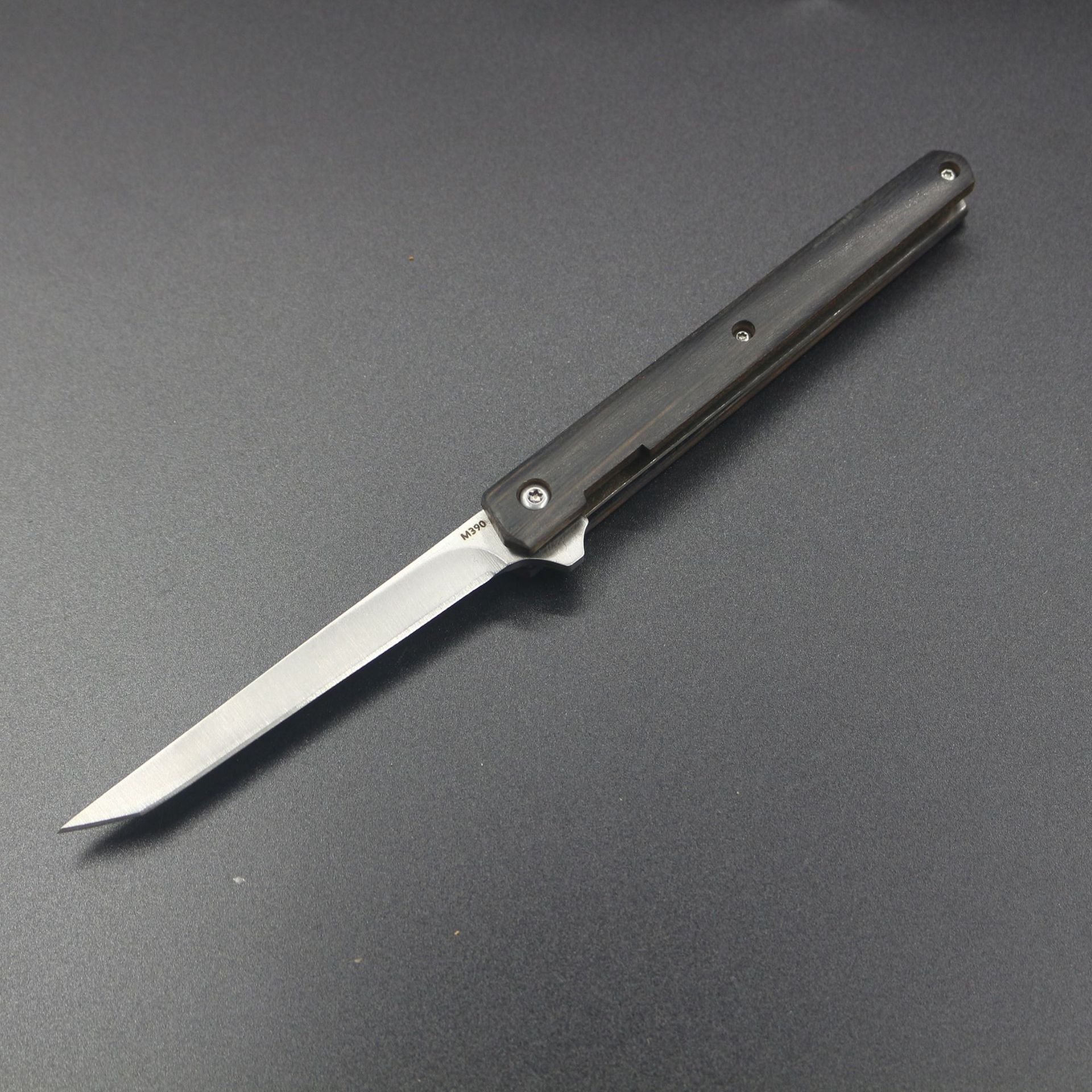 Multi-purpose outdoor camper with a folding tool and a knife with a mini-scissor