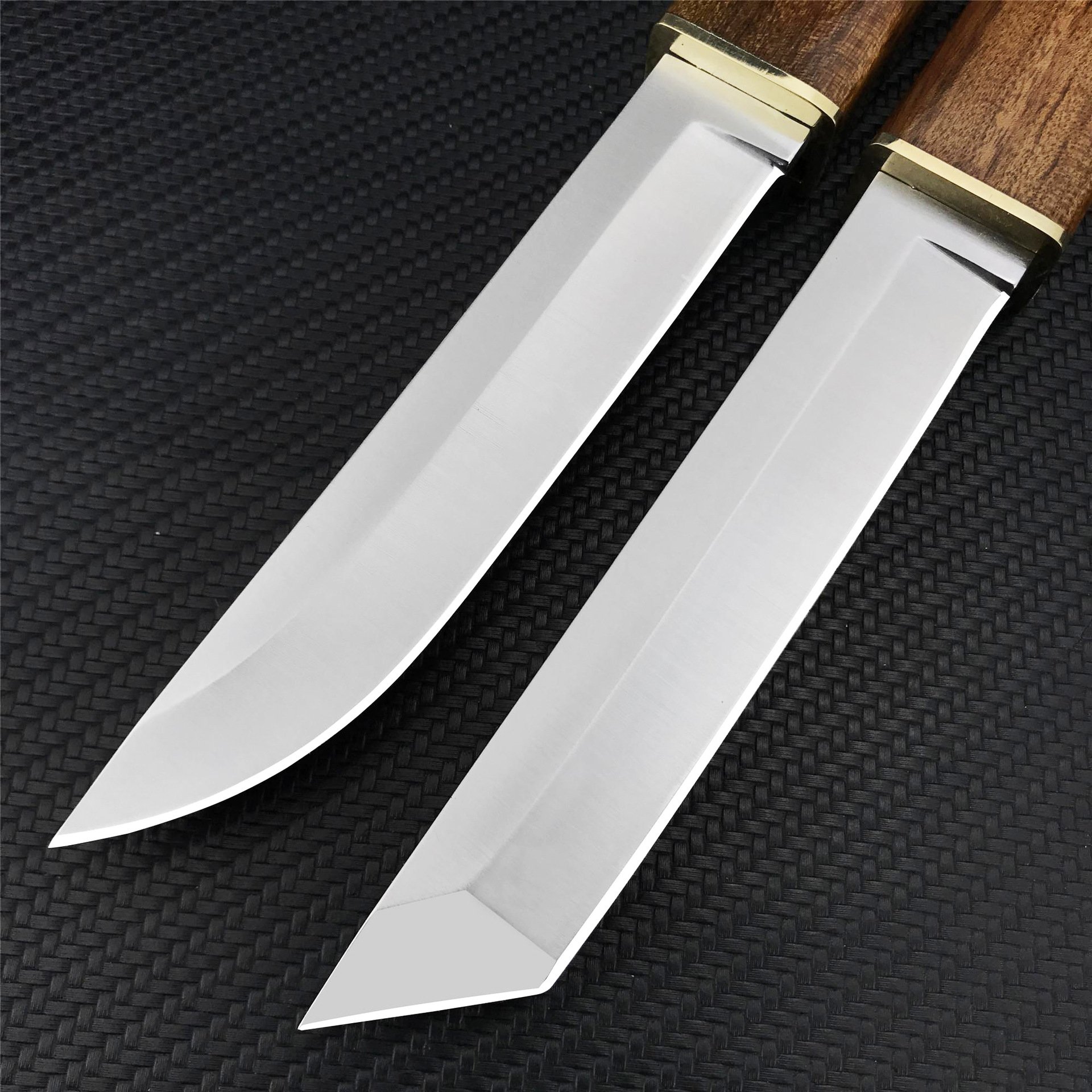 Kikida's two-knife, two-knife, two-knife, two-knife, two-knife, one-strike, and he's carrying a camp knife