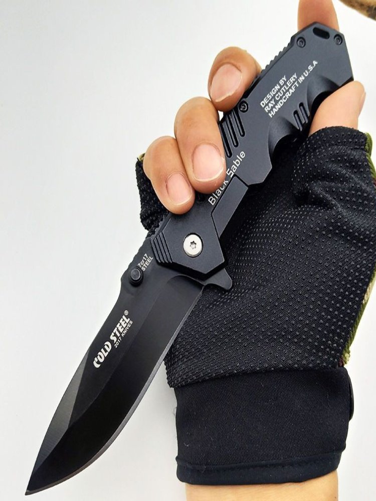 The camping knife was folded with a small knife and a small fruit knife with a mini camper knife