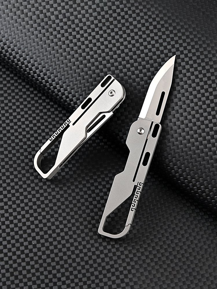 THE TITANIUM ALLOY MINI-VANTAGE HAND-OFF WITH THE EDC MULTI-PURPOSE KEY BELT FOLDING AND FRUIT KNIFE
