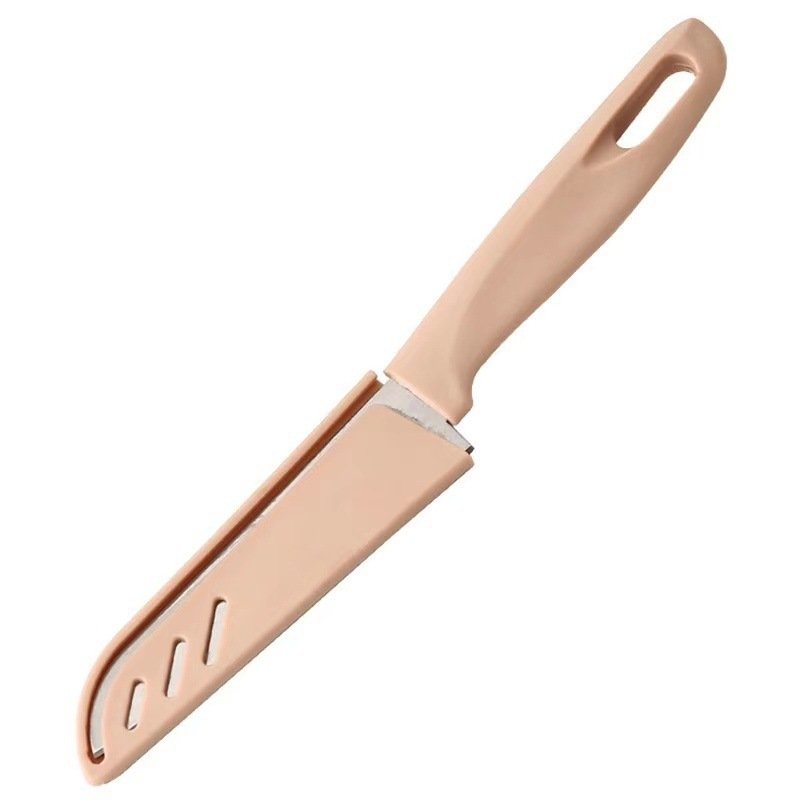 Fruit and steel cutter with a knife in the kitchen
