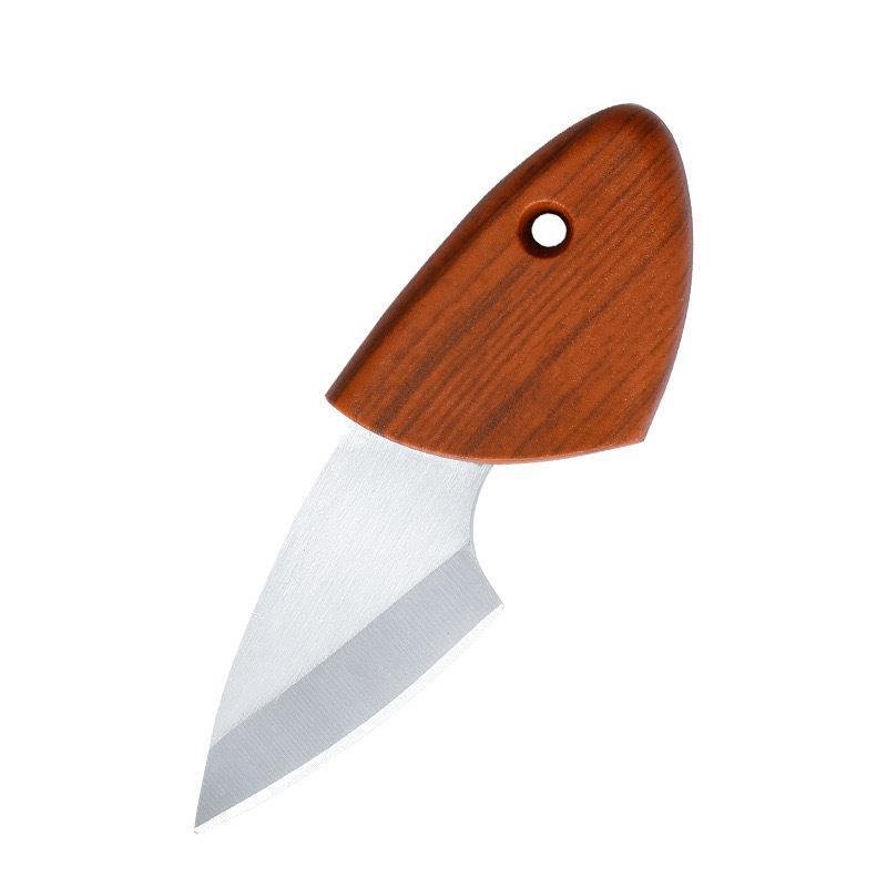 The mini-fish with a thick knife at home with a kitchen cutter and a fruit knife to break the delivery box