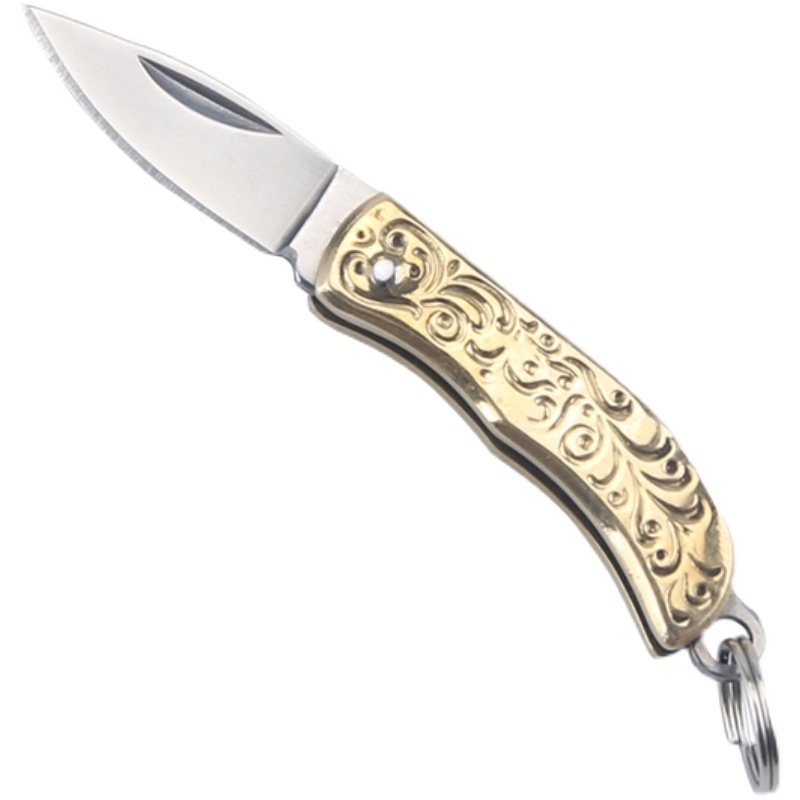 A hand-made mini-cleaver with a hand-carrying hand-carved knife, a pocket-carrying brass and fruit knife, and a key to a small knife