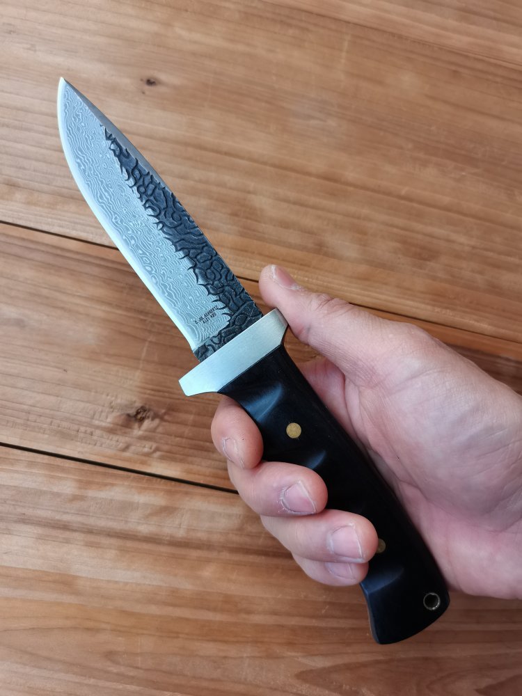 Damascus has a hand-to-hand exercise to survive with camping equipment with a small straight knife in his coat