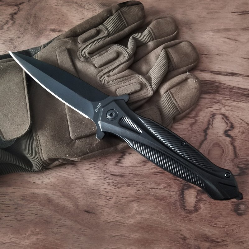 An outdoor tactical folding knife with a high-strength sharp defensive knife and a field survival equipment camping tool