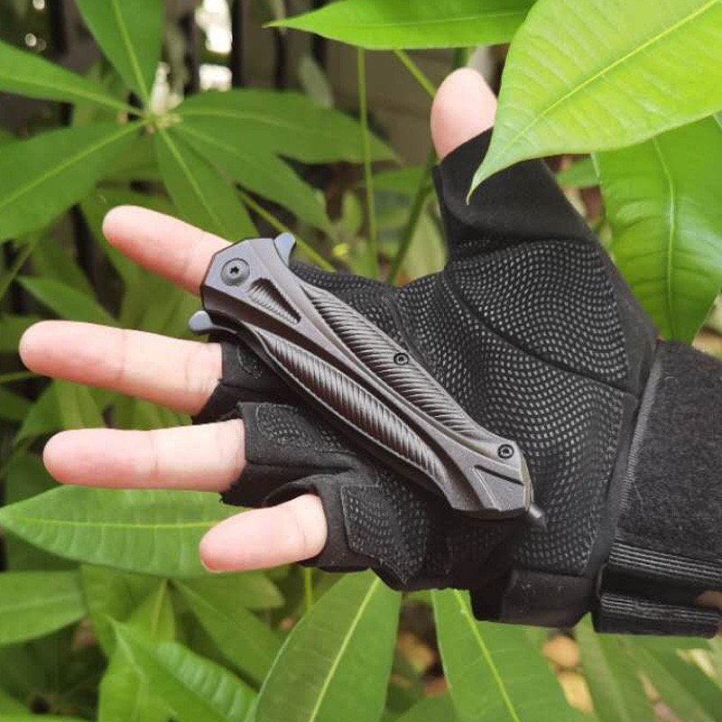 An outdoor tactical folding knife with a high-strength sharp defensive knife and a field survival equipment camping tool