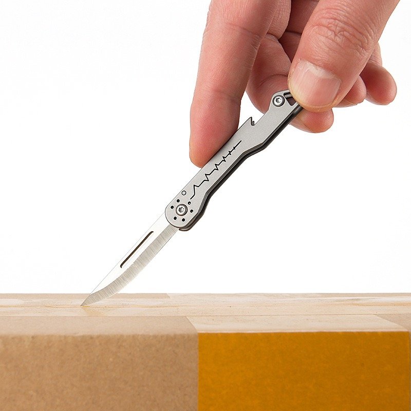 A multi-purpose titanium alloy knife can open a bottle of a key knife and fold a paper knife