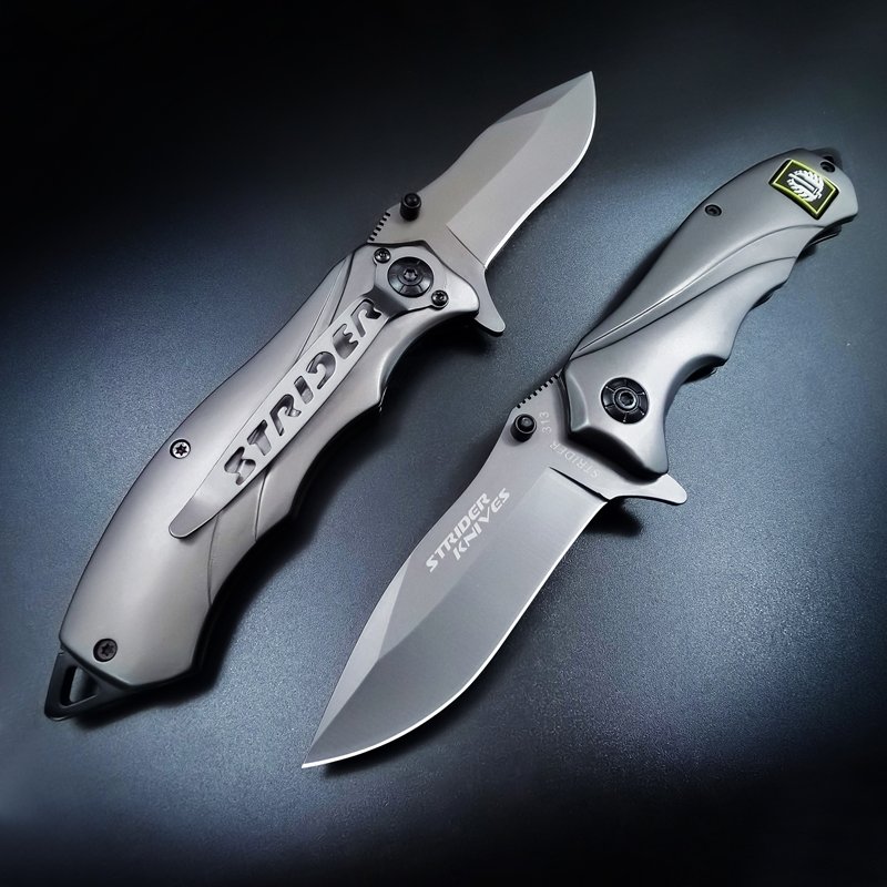 A small outdoor knife folded with a mini-man's hand, with a short cutter for stainless steel