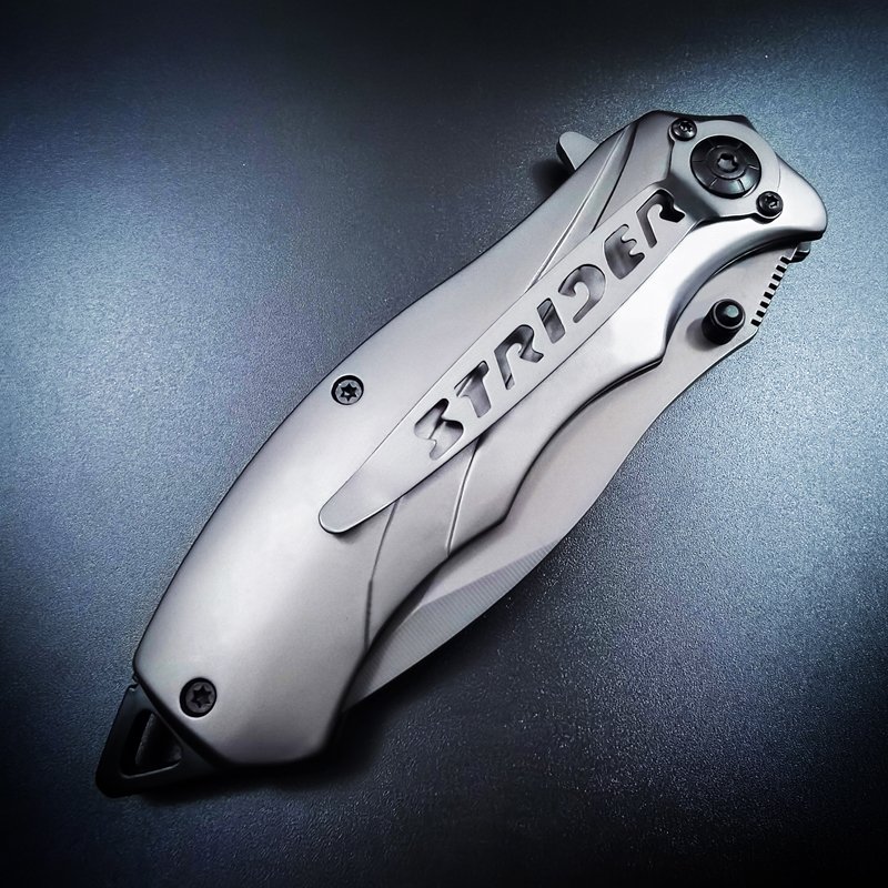 A small outdoor knife folded with a mini-man's hand, with a short cutter for stainless steel