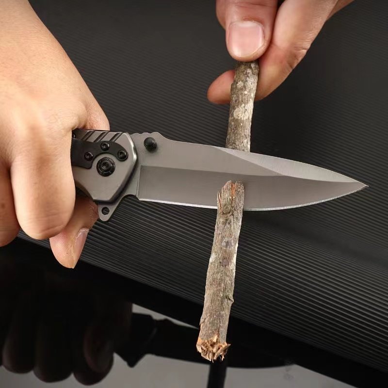 An outdoor multi-purpose anti-fouling knife, a high-strength tactical knife, and a slash and a fruit knife
