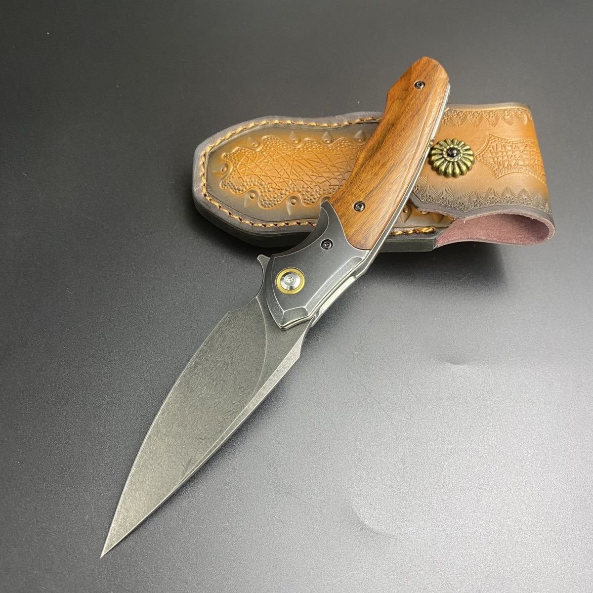 Uzi Phoenix camping outside with multipurpose knives
