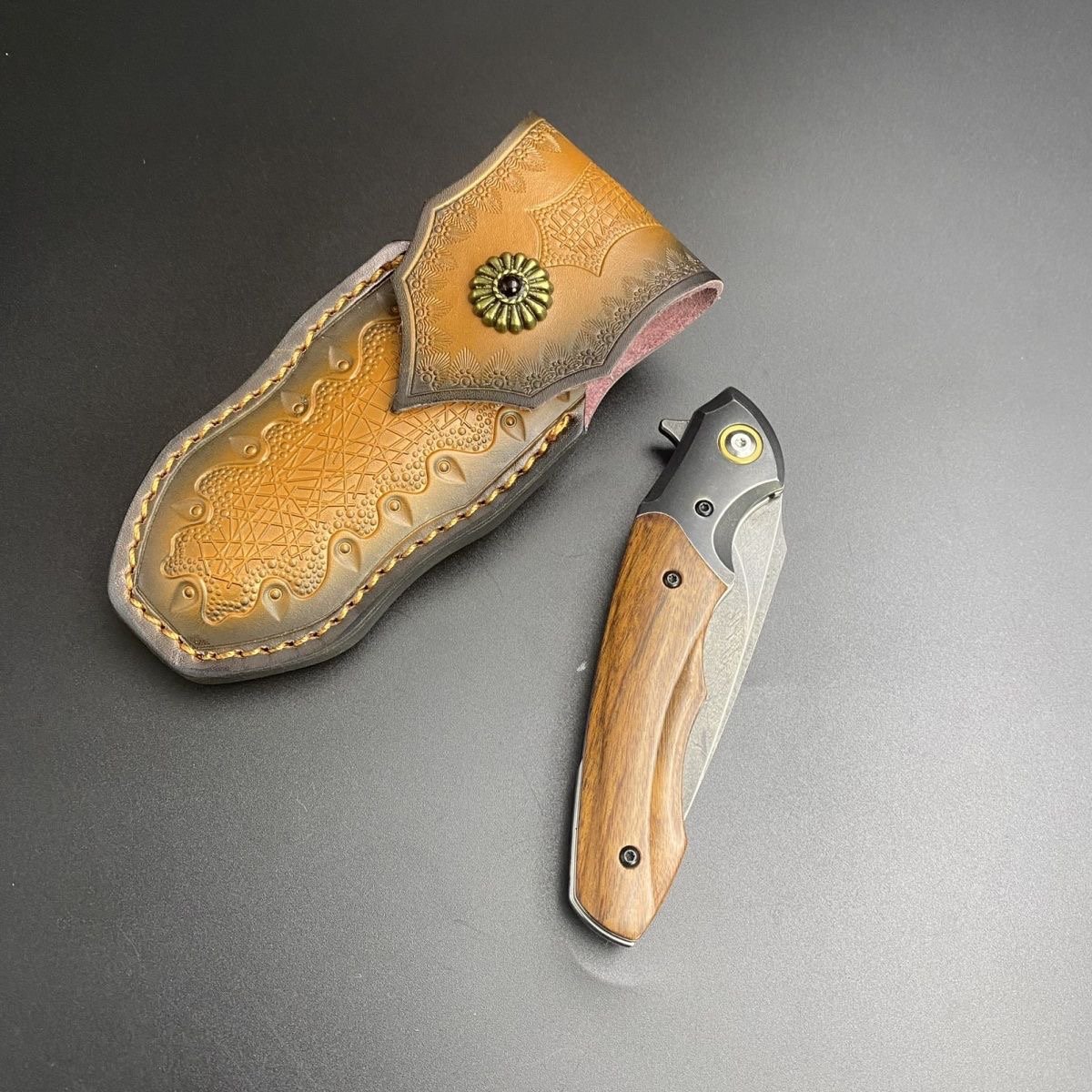 Uzi Phoenix camping outside with multipurpose knives