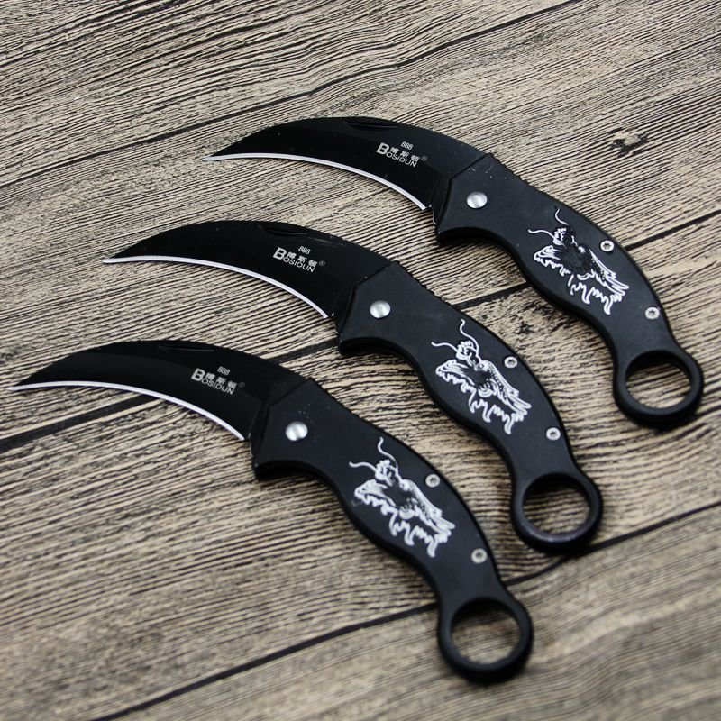 An outdoor claw-and-scratch camp with a stale fruit knife folds a small steel knife